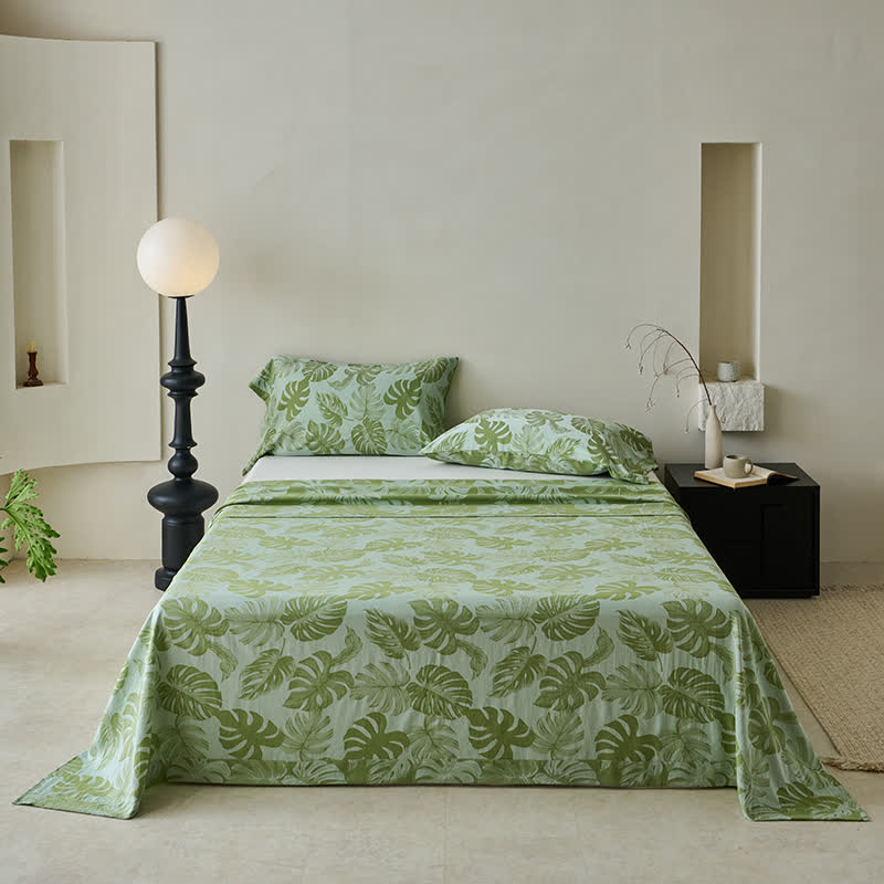 Grüne Tagesdecke aus Baumwollgaze-Jacquard mit Monstera-Motiv – de.ownkoti