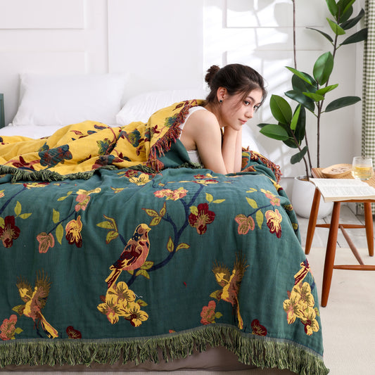 Wendesteppdecke aus Baumwolle mit Blumenmuster und Quasten „Magpie“