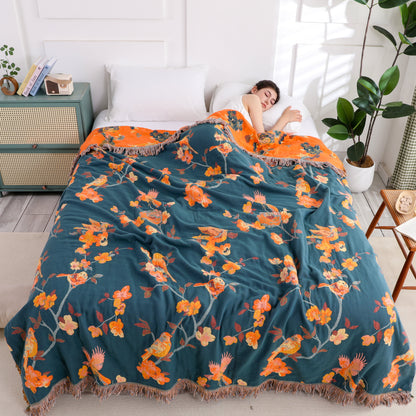 Wendesteppdecke aus Baumwolle mit Blumenmuster und Quasten „Magpie“