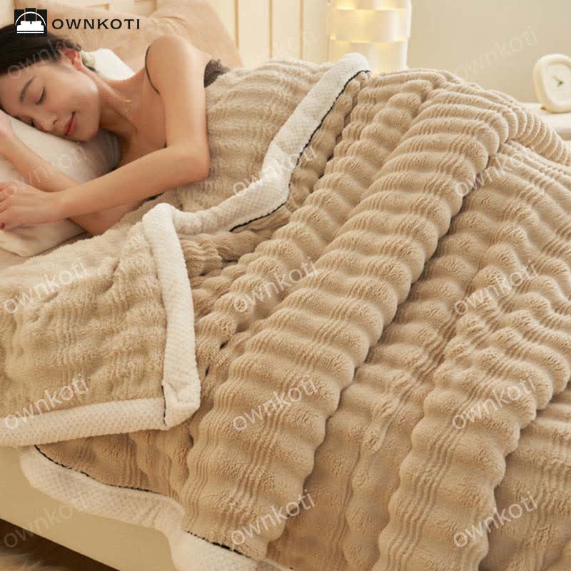 Fleecedecke mit Jacquard-Wellenstruktur