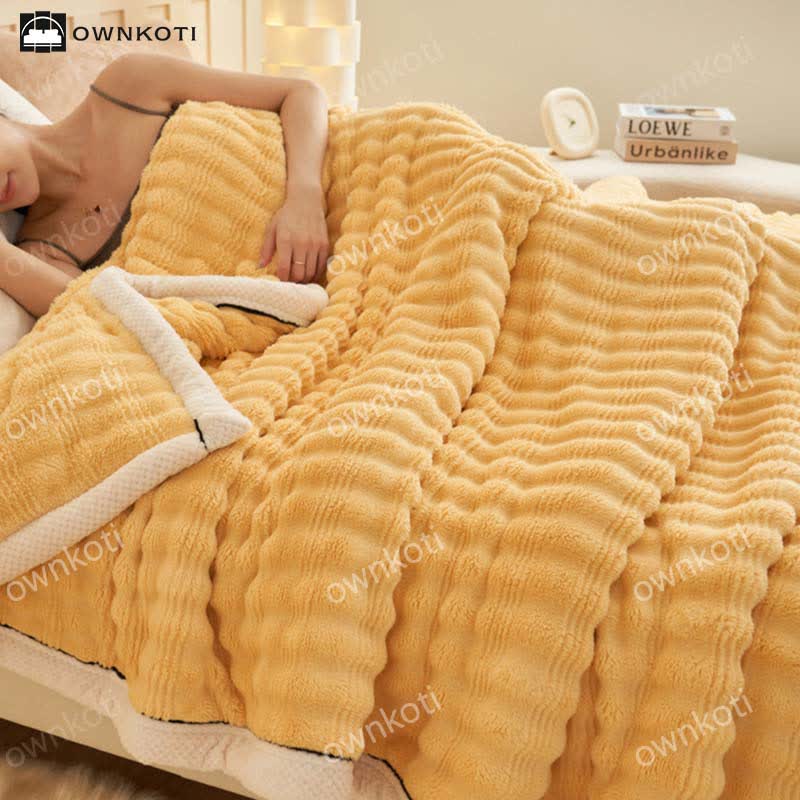 Fleecedecke mit Jacquard-Wellenstruktur