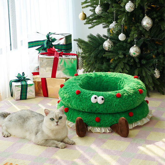 Süßes, weiches Haustierbett mit Weihnachtskranz