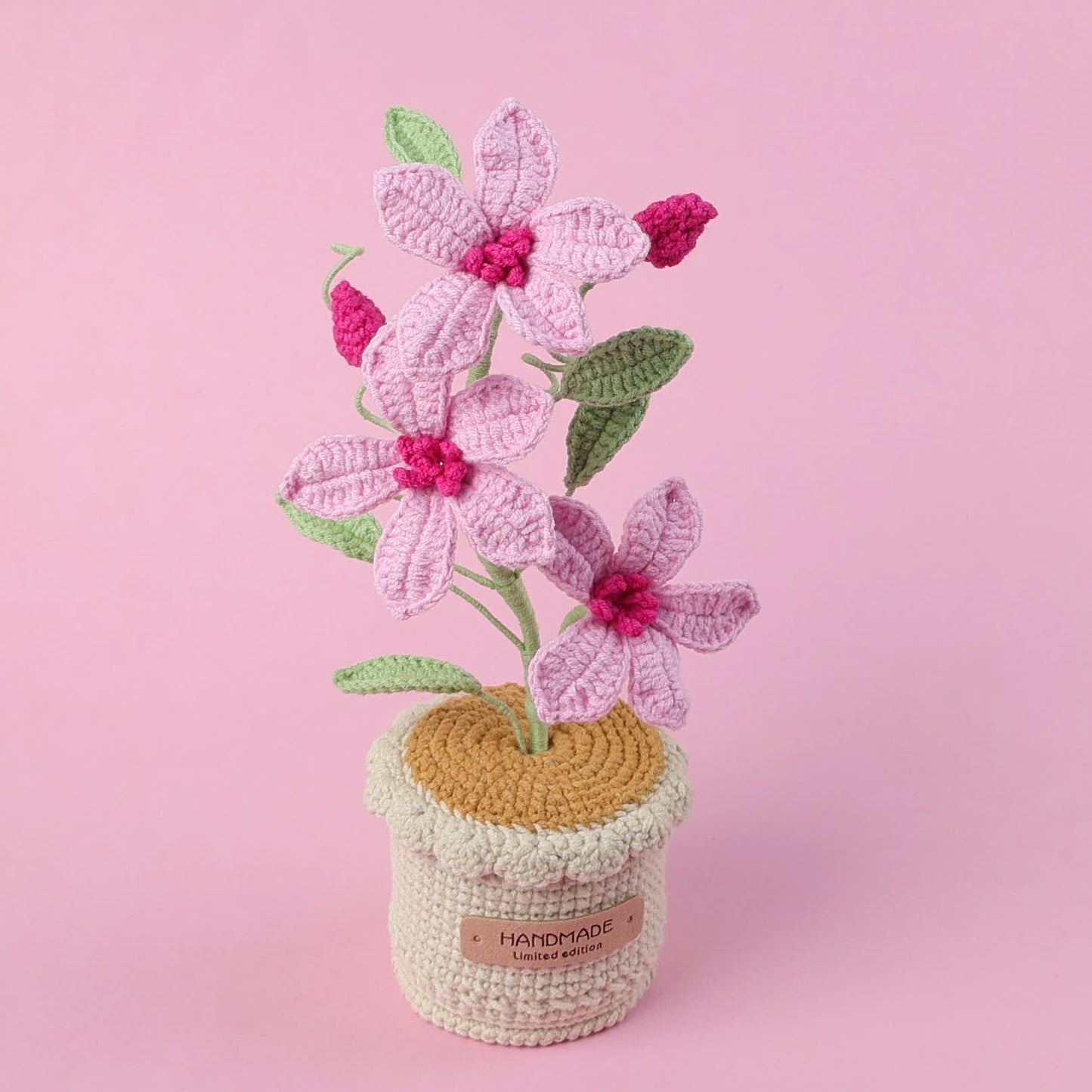 Gewebtes Blumenornament Clematis im Topf