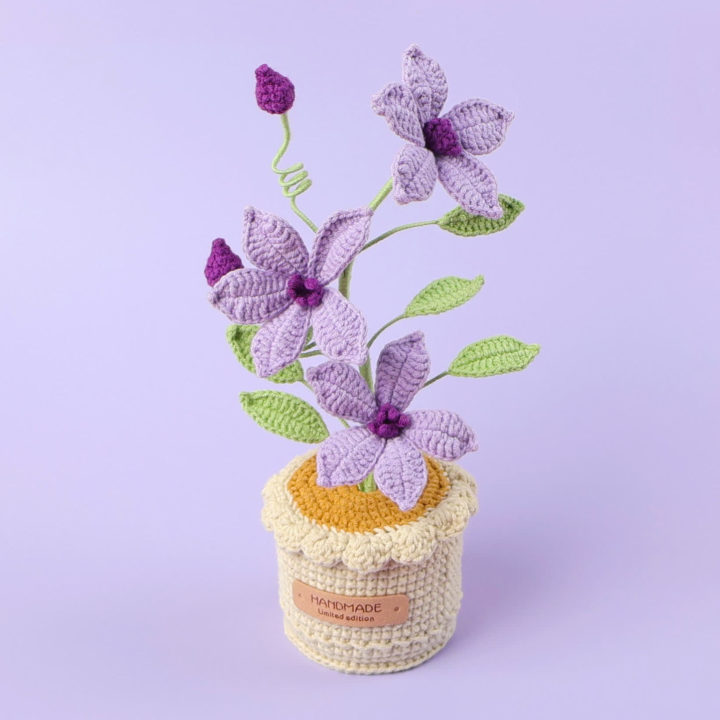 Gewebtes Blumenornament Clematis im Topf