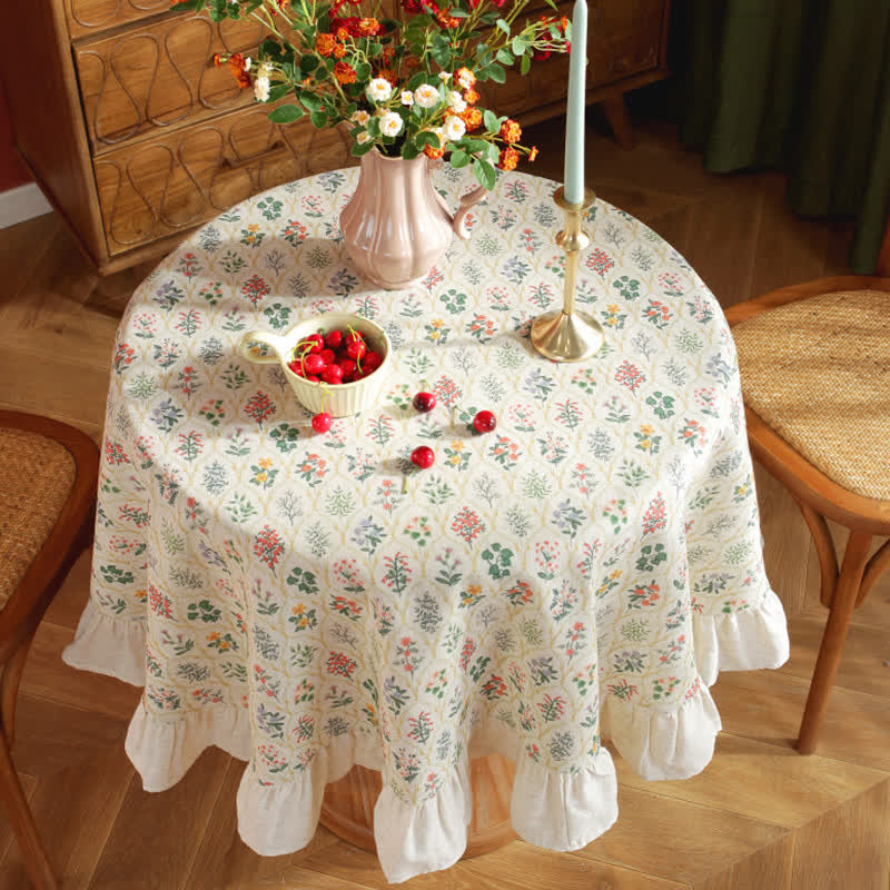 Runde Tischdecke mit Rüschen und grünem Pflanzendruck im Pastoralstil