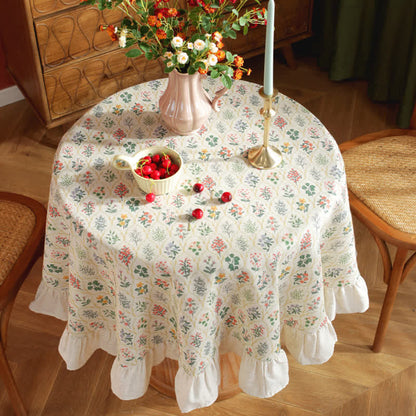 Runde Tischdecke mit Rüschen und grünem Pflanzendruck im Pastoralstil