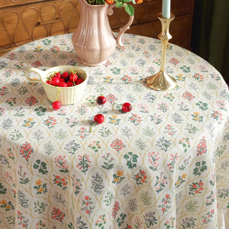 Runde Tischdecke mit Rüschen und grünem Pflanzendruck im Pastoralstil