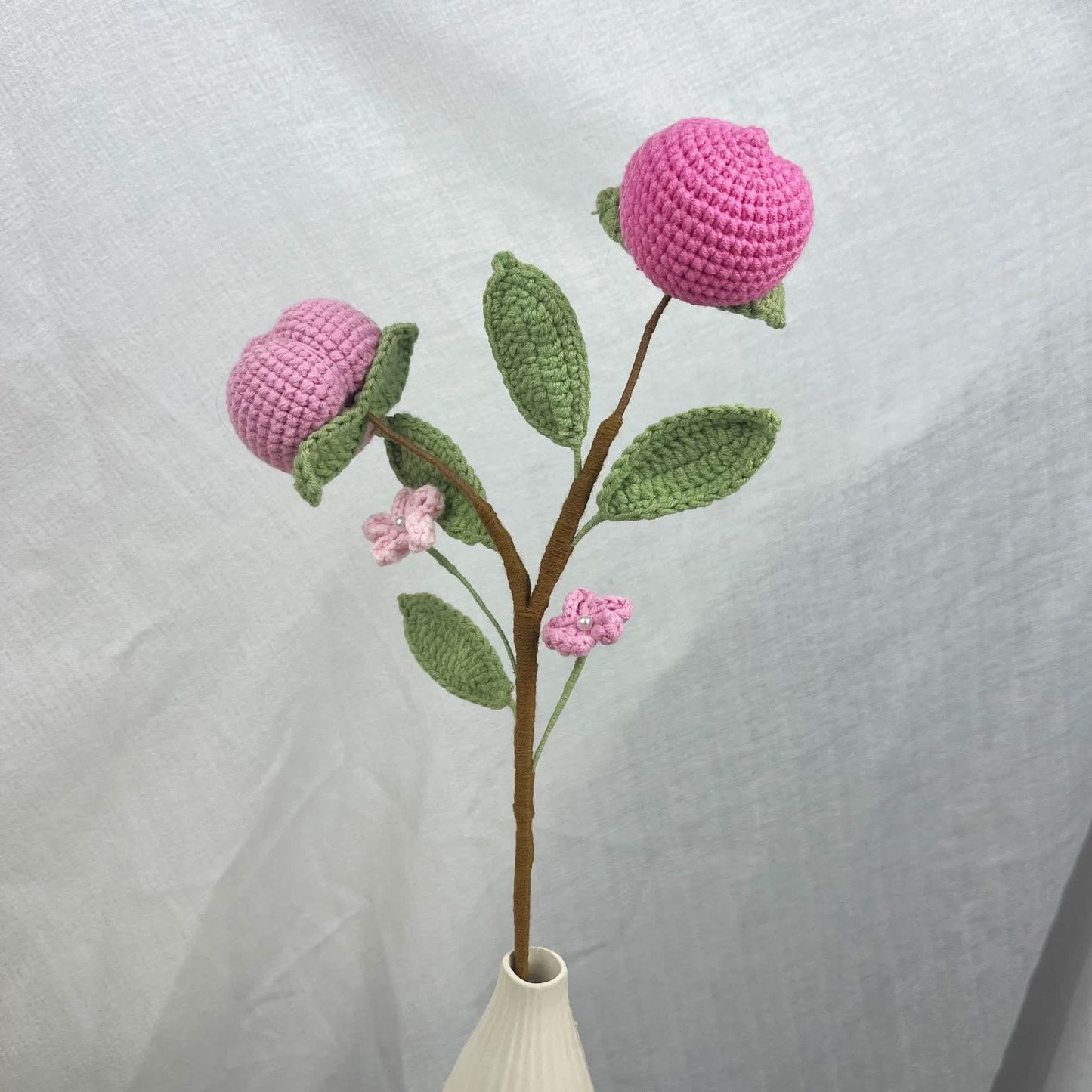 Kreativer handgemachter gestrickter gehäkelter Obststrauß