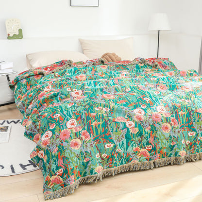 Wendedecke aus Baumwollgaze mit Blumenmuster und Quasten