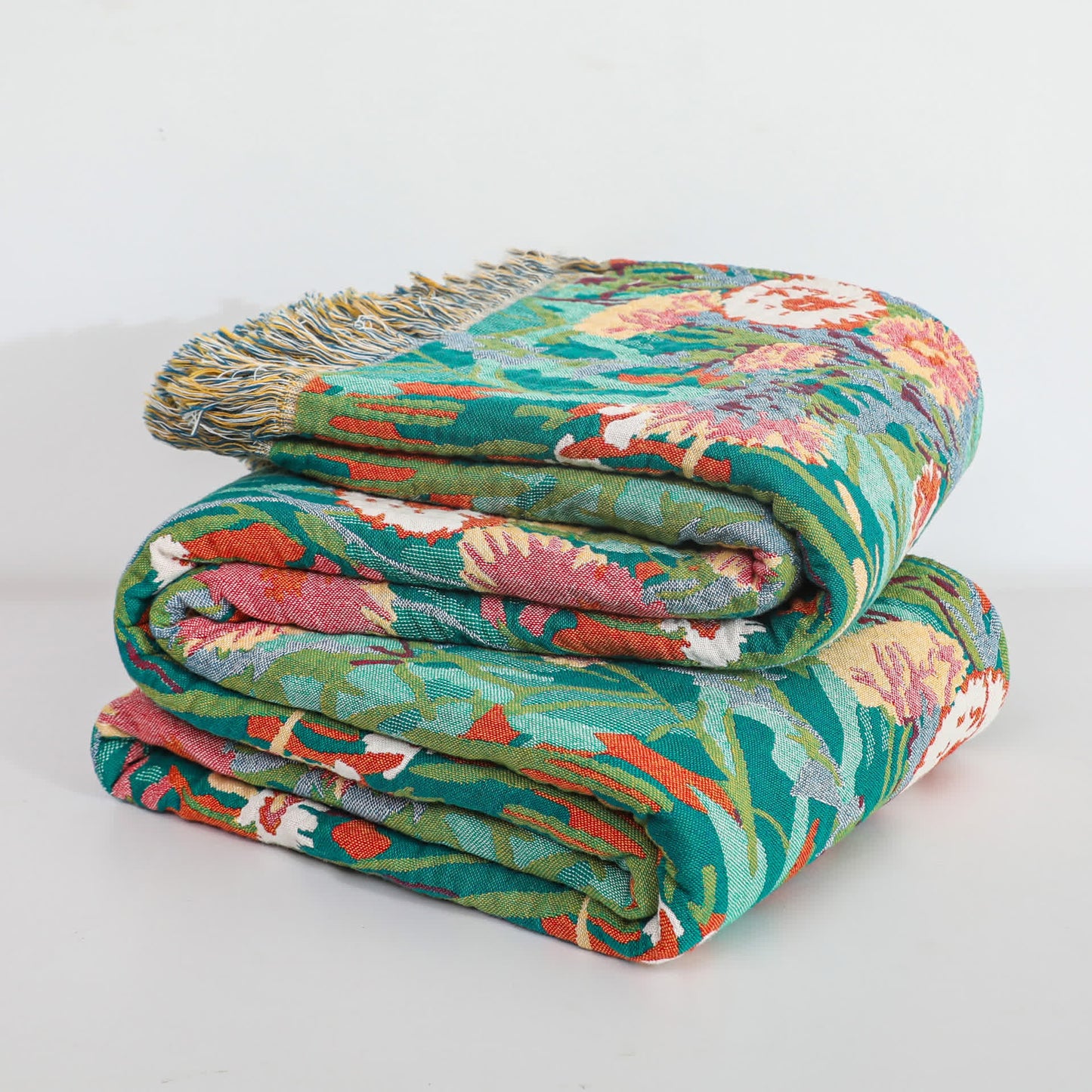 Wendedecke aus Baumwollgaze mit Blumenmuster und Quasten