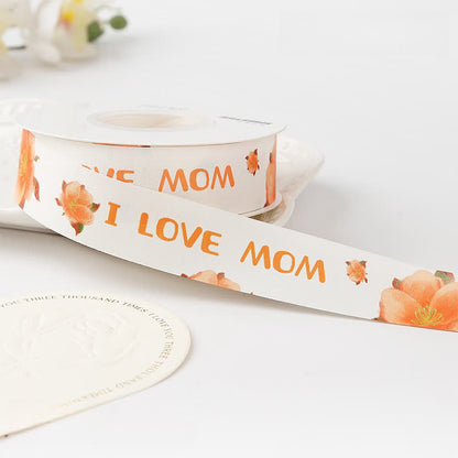 Muttertagsgeschenkbox mit Blumenstrauß und Satinband