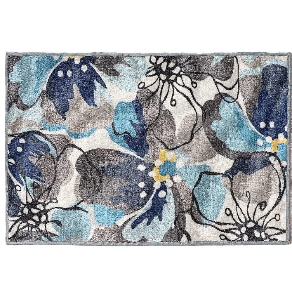 Teppich mit tropischen Blättern und Blumen