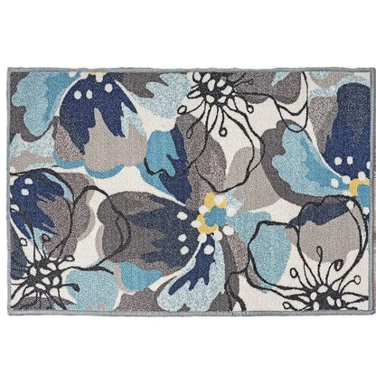Teppich mit tropischen Blättern und Blumen