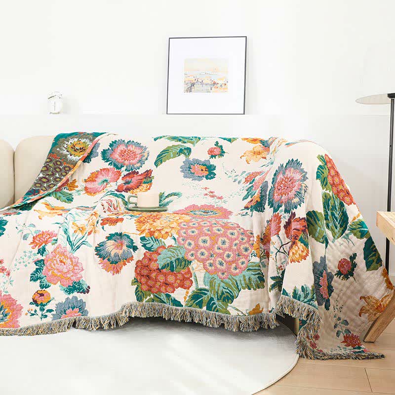 Wendesteppdecke aus mehrlagiger Baumwollgaze mit Blumenmuster und Quasten