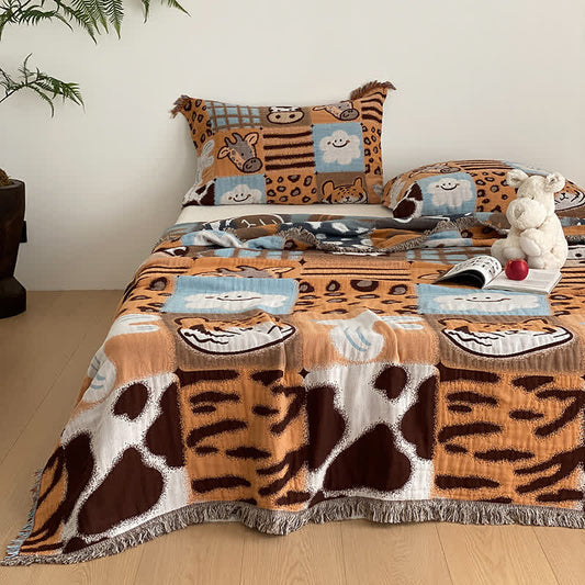 Vierlagige Steppdecke aus Baumwollgaze mit Quasten und Animalprint