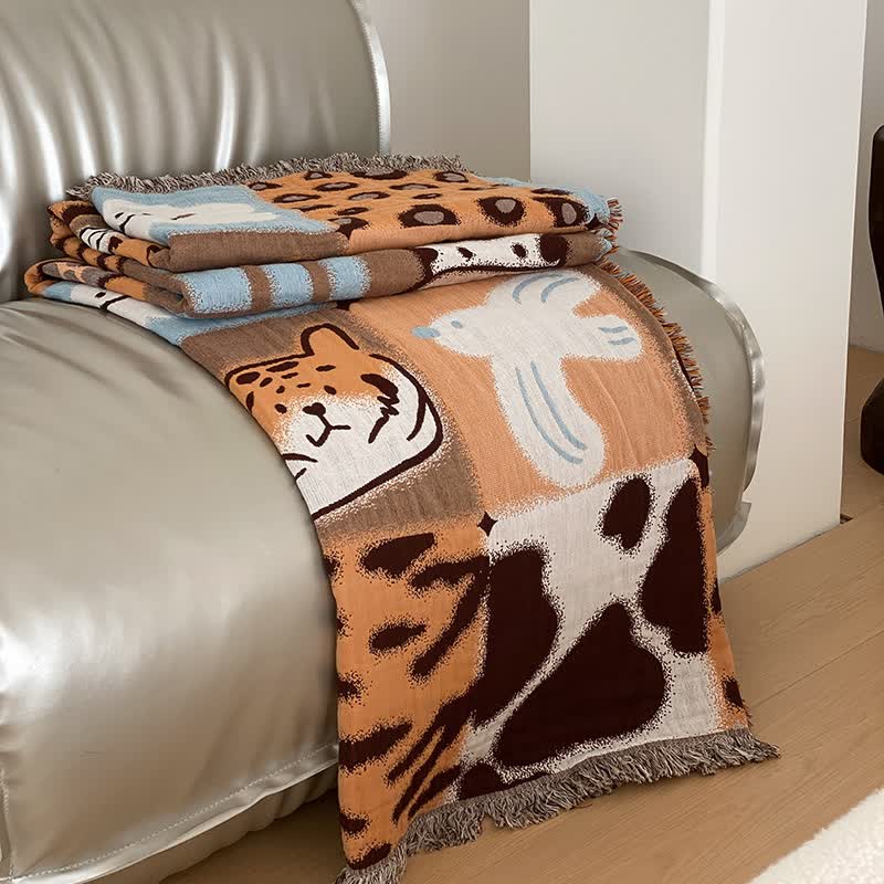 Vierlagige Steppdecke aus Baumwollgaze mit Quasten und Animalprint