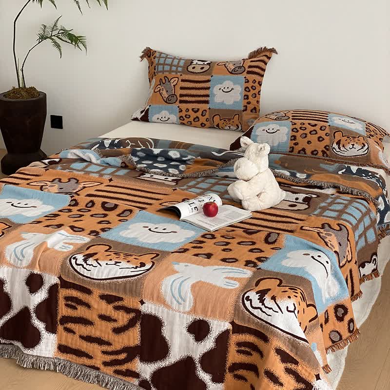 Vierlagige Steppdecke aus Baumwollgaze mit Quasten und Animalprint