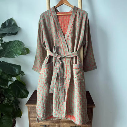 Orangefarbener Kimono aus Baumwolle mit Monstera-Print
