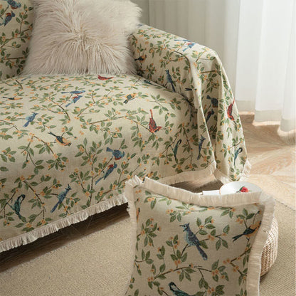 Weicher Sofaschoner mit Quasten und Blumen- und Vogelmotiv