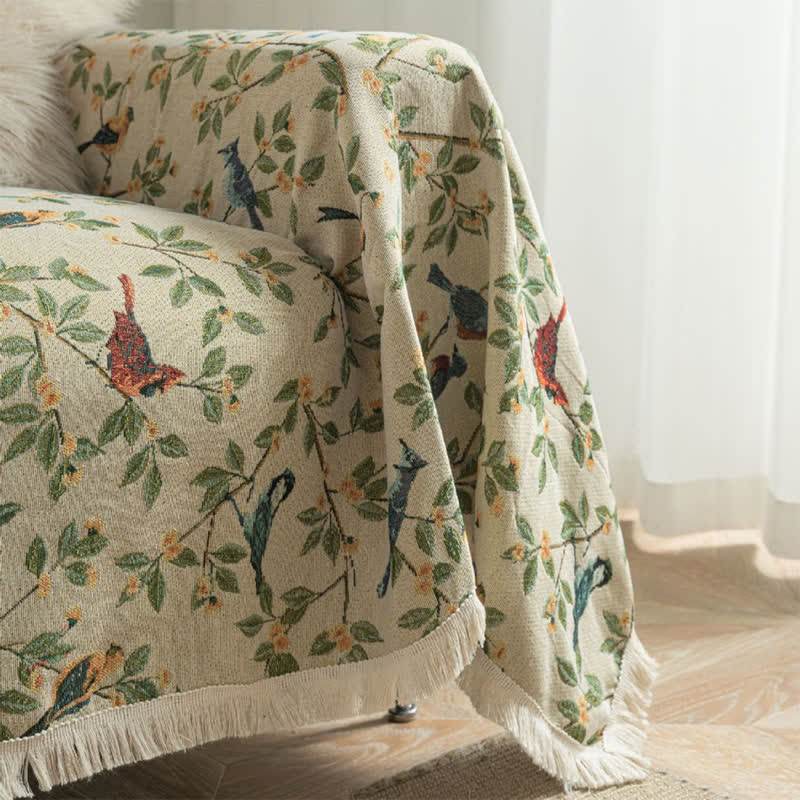 Weicher Sofaschoner mit Quasten und Blumen- und Vogelmotiv