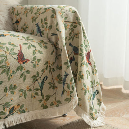 Weicher Sofaschoner mit Quasten und Blumen- und Vogelmotiv