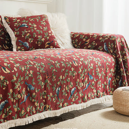 Weicher Sofaschoner mit Quasten und Blumen- und Vogelmotiv
