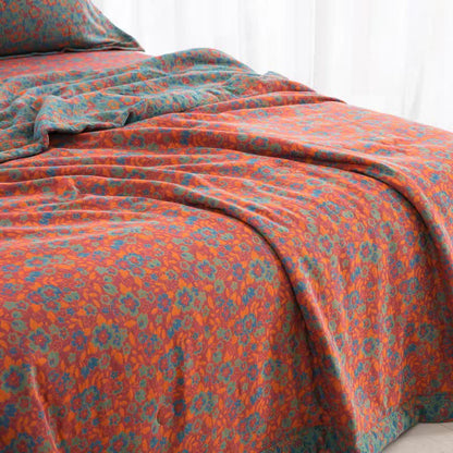Orangefarbene Jacquard-Steppdecke aus Baumwollgaze mit Blumenmuster