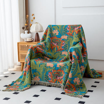 Poppy Decke aus natürlicher Baumwolle mit Quasten