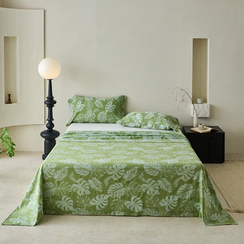 Grüne Tagesdecke aus Baumwollgaze-Jacquard mit Monstera-Motiv
