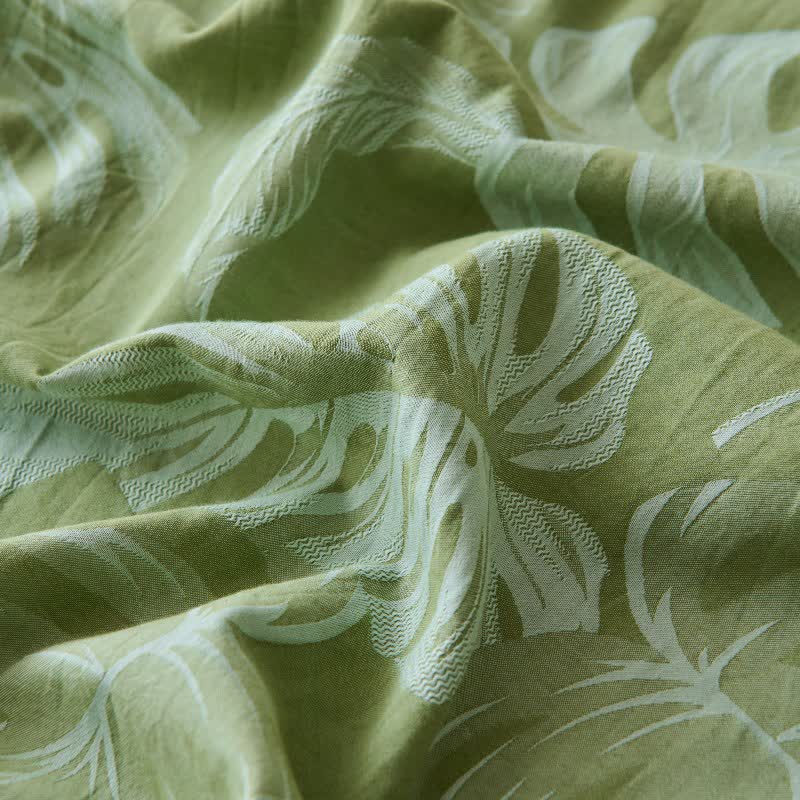 Grüne Tagesdecke aus Baumwollgaze-Jacquard mit Monstera-Motiv - image 8