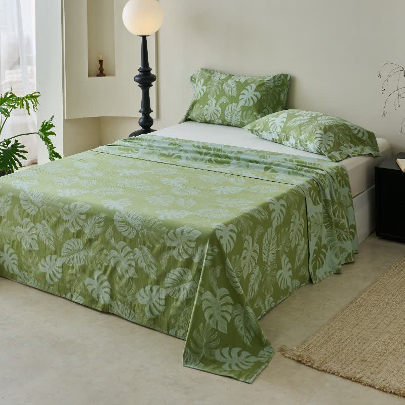 Grüne Tagesdecke aus Baumwollgaze-Jacquard mit Monstera-Motiv - image 6