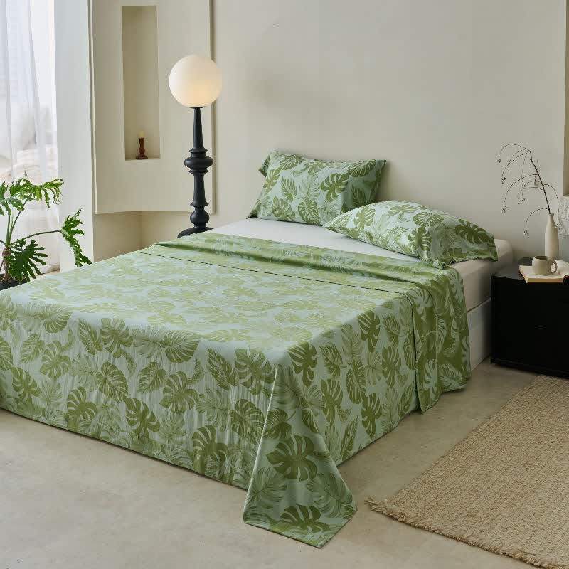 Grüne Tagesdecke aus Baumwollgaze-Jacquard mit Monstera-Motiv - image 2