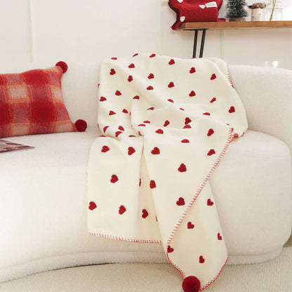 Herzförmige Kuscheldecke mit Pompons - image 2