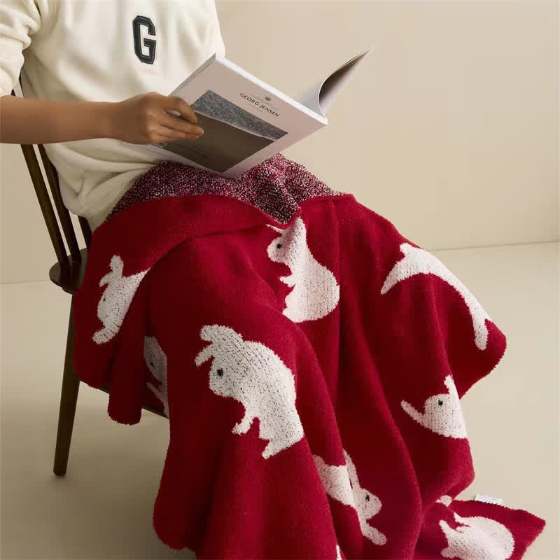 Strickdecke im nordischen Stil mit Kaninchenmotiv - image 1