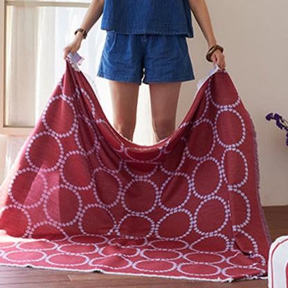 Wendbare Kuscheldecke mit Kreismuster und Quasten - image 4