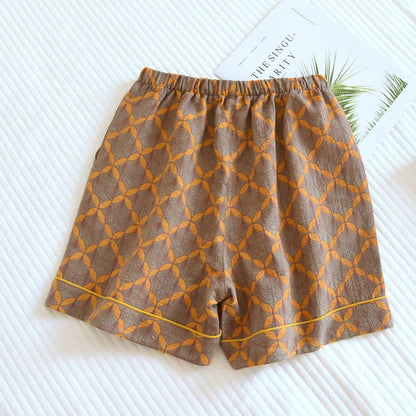 Gelbe karierte Pyjama-Shorts aus Baumwollgaze - image 1