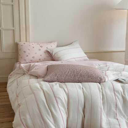Vierteiliges Bettwäsche-Set aus gewaschener Baumwolle mit rosa Blütenmuster - image 1