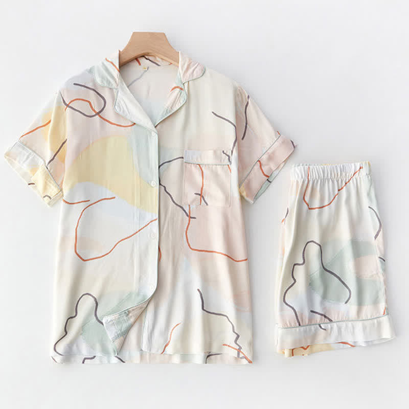 Loungewear-Set aus Satin mit abstraktem Print und kurzen Ärmeln - image 1