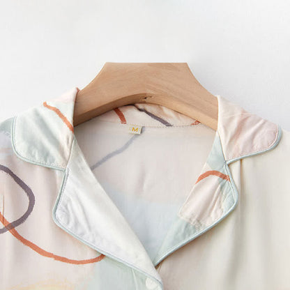 Loungewear-Set aus Satin mit abstraktem Print und kurzen Ärmeln - image 3