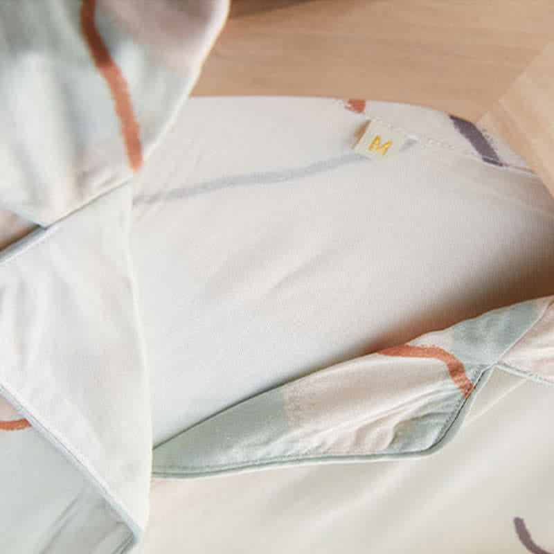 Loungewear-Set aus Satin mit abstraktem Print und kurzen Ärmeln - image 9