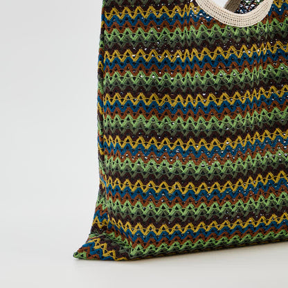 Grüne Schultertasche mit Wellenstreifen - image 5