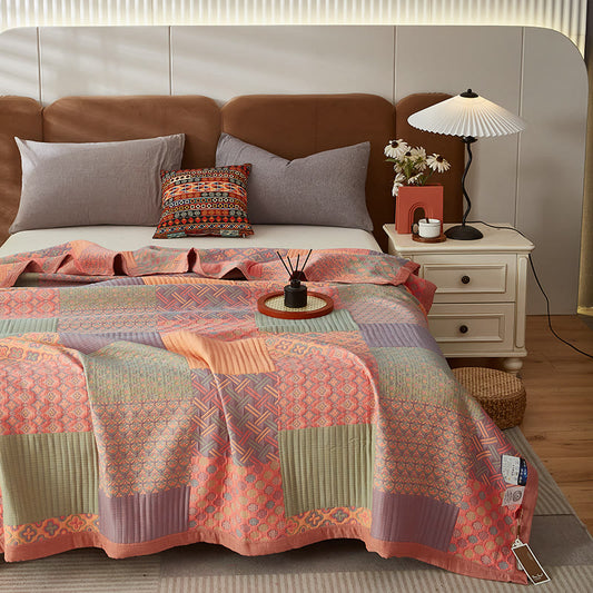 Bunte Wendesteppdecke aus Baumwolle mit quadratischem Muster