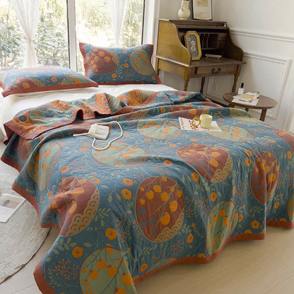 Doppelseitige Steppdecke aus Baumwolle mit Persimmon-Blumenmotiv