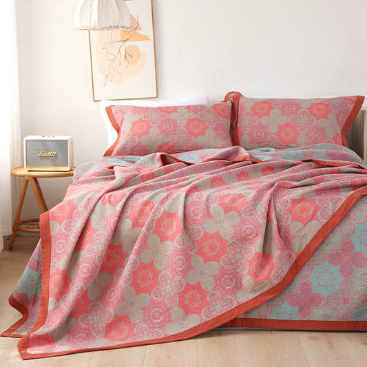 Wendbare Steppdecke aus Baumwollgaze mit Patchwork-Blumenmuster