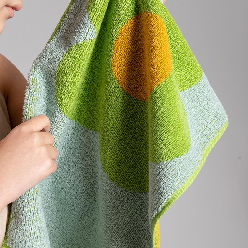 Atmungsaktives Baumwollhandtuch mit Blumenmuster und Farbblockdesign